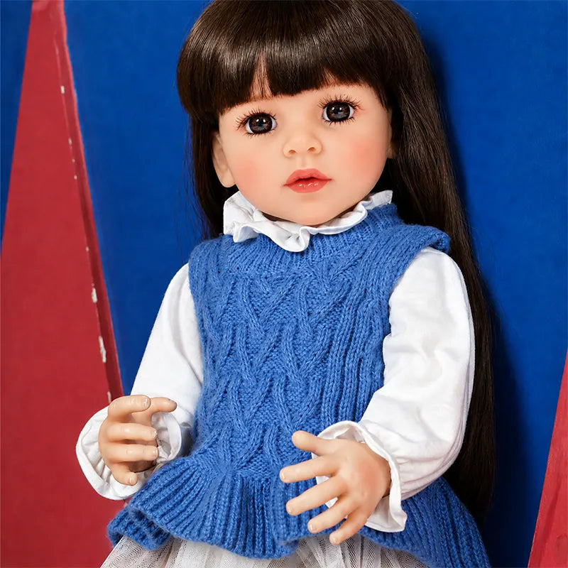 Lifelike reborn baby doll with finely sculpted facial features, carefully painted skin tones, realistic hands, and detailed hair styling.