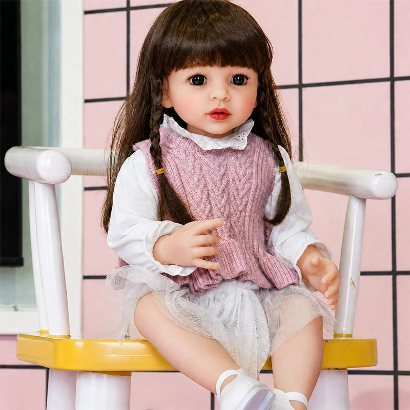 Reborn baby girl doll dressed in pink, perfect for pretend play, tea parties, dress-up games, and birthday gifts.