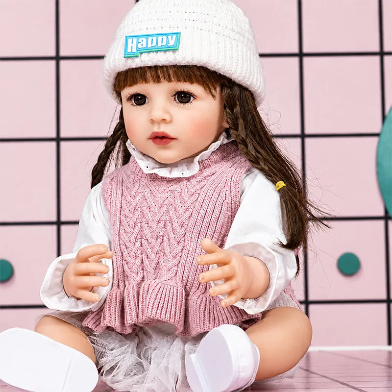 Realistic reborn girl doll crafted with detailed facial coloring, natural-looking skin tones, carefully styled hair, and fine lifelike features.
