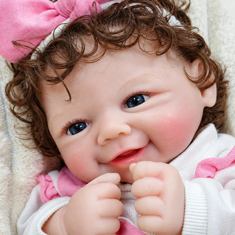 Sweet silicone baby with glossy lips, gentle eyes, natural rosy coloring, curled brown hair, and carefully crafted lifelike details for display or gifting.