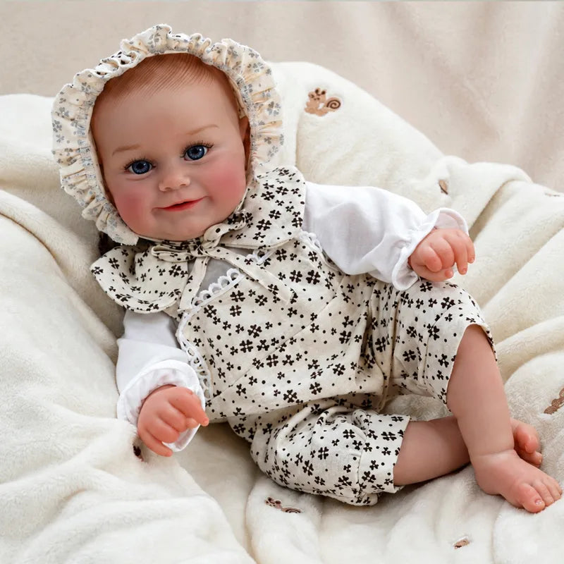 Baby doll wearing a ruffled floral bonnet, white long-sleeved top and matching floral romper.