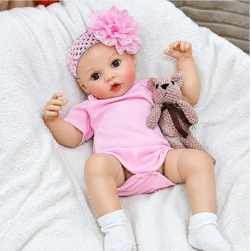 Maisie offers a fun nurturing experience with her bottle-feeding feature, cute open-eyed expression, delicate fingers, soft-looking limbs, and cheerful pink styling.