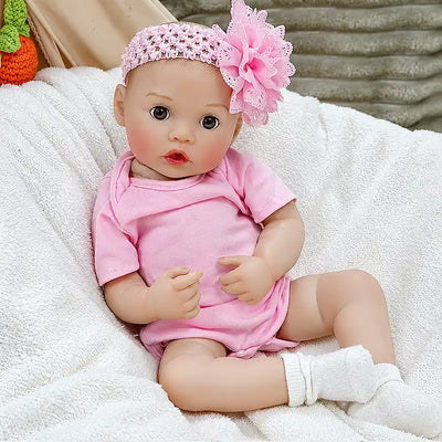 Maisie brings charm to everyday play with her bottle-feeding feature, soft pink clothes, flower headband, realistic facial details, and cuddly baby style.