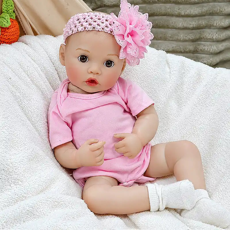 Maisie brings charm to everyday play with her bottle-feeding feature, soft pink clothes, flower headband, realistic facial details, and cuddly baby style.