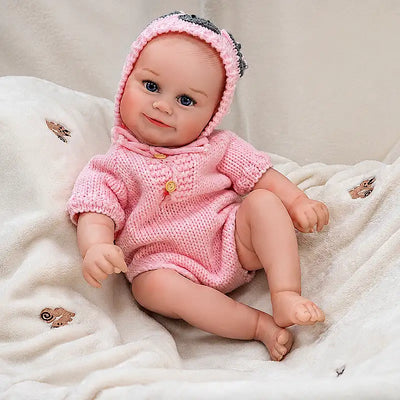 Realistic Reborn Baby Doll Sitting on a Cozy Blanket for Morning Playtime