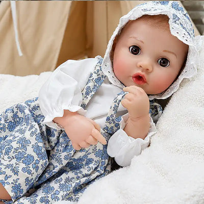 Cute realistic reborn baby Ellis with a sweet open-mouth expression, ready for bottle-feeding, cuddles, and playful nursery adventures.