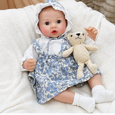 Ellis is dressed in a charming blue-and-white floral set, perfect for bottle-feeding play, bedtime routines, nursery photos, and cozy cuddles.