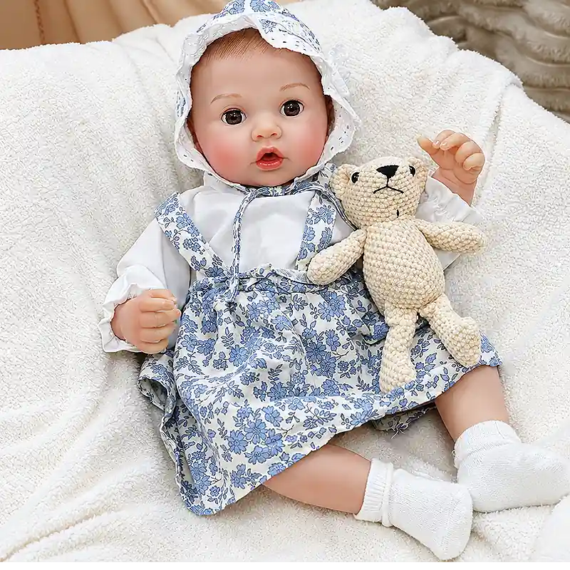 Ellis is dressed in a charming blue-and-white floral set, perfect for bottle-feeding play, bedtime routines, nursery photos, and cozy cuddles.
