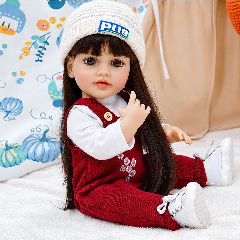 Charlotte has expressive brown eyes, painted lashes, glossy lips, delicate fingers, and a soft lifelike finish, designed for collectors, children, and gift giving.