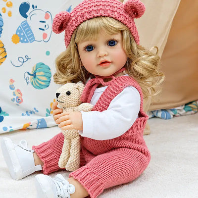 Adorable Isabella with sparkling blue eyes, a gentle smile, and a cuddly teddy bear, ideal for nurturing role play, companionship, birthdays, and Christmas gifts.