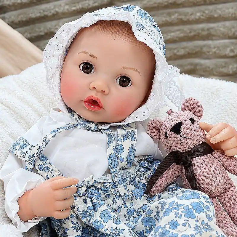 Lifelike baby doll with an open-mouth expression, expressive eyes, tiny fingers, soft-looking limbs, and carefully crafted facial details for interactive feeding fun.