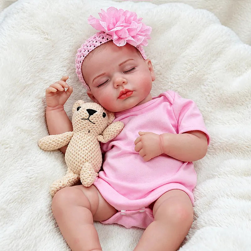 Pink Sleeping Reborn Baby Doll with a Peaceful Expression, Floral Headband and Teddy Bear