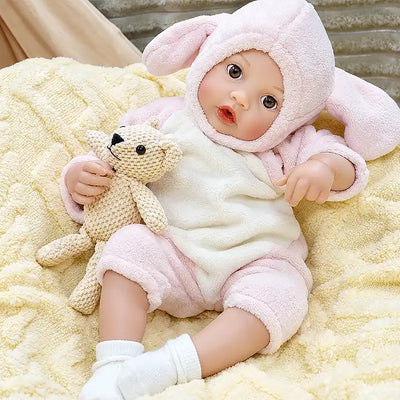 Sweet reborn baby Ella is ready for bottle time, storytime, and snuggles in her pink bunny outfit, bringing playful charm to everyday pretend parenting.