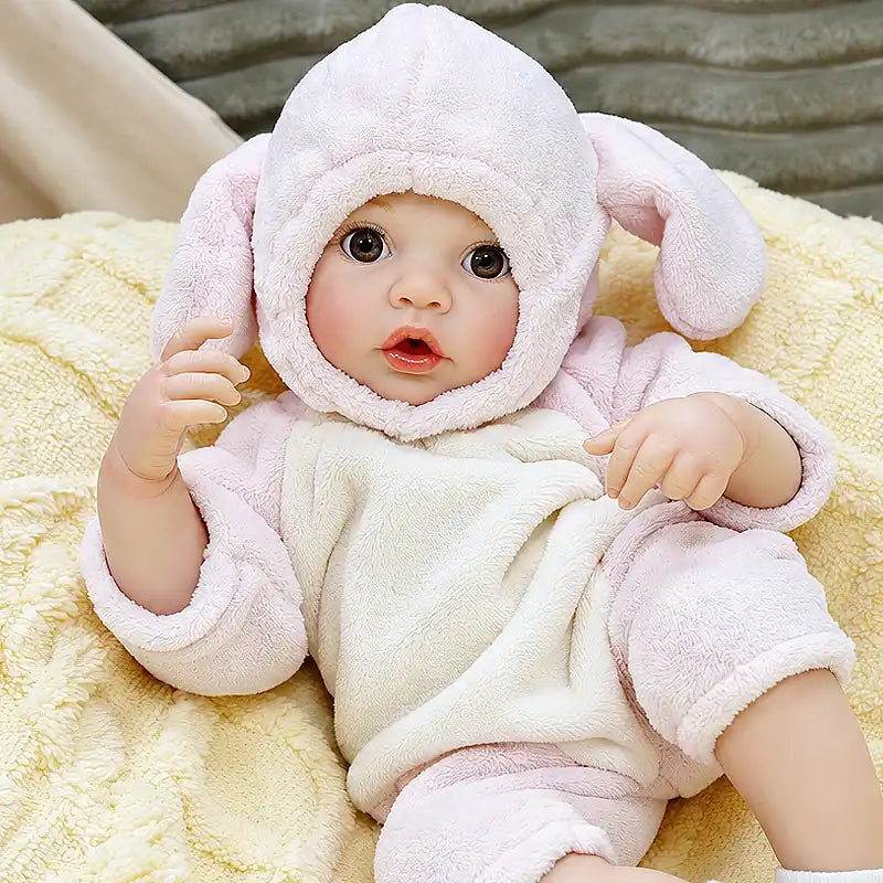 Ella offers a fun caregiving experience with her realistic baby look, expressive eyes, tiny hands, and adorable bunny clothing, ideal for children ages 3+.