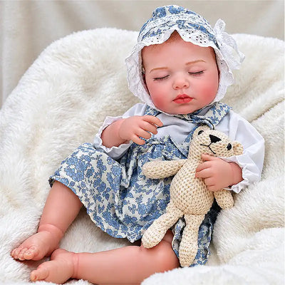 Realistic Sleeping Baby Doll Wearing a Blue Floral Dress and Matching Bonnet