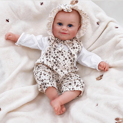 Baby doll resting on a cream blanket, ready for a cozy afternoon of pretend play.