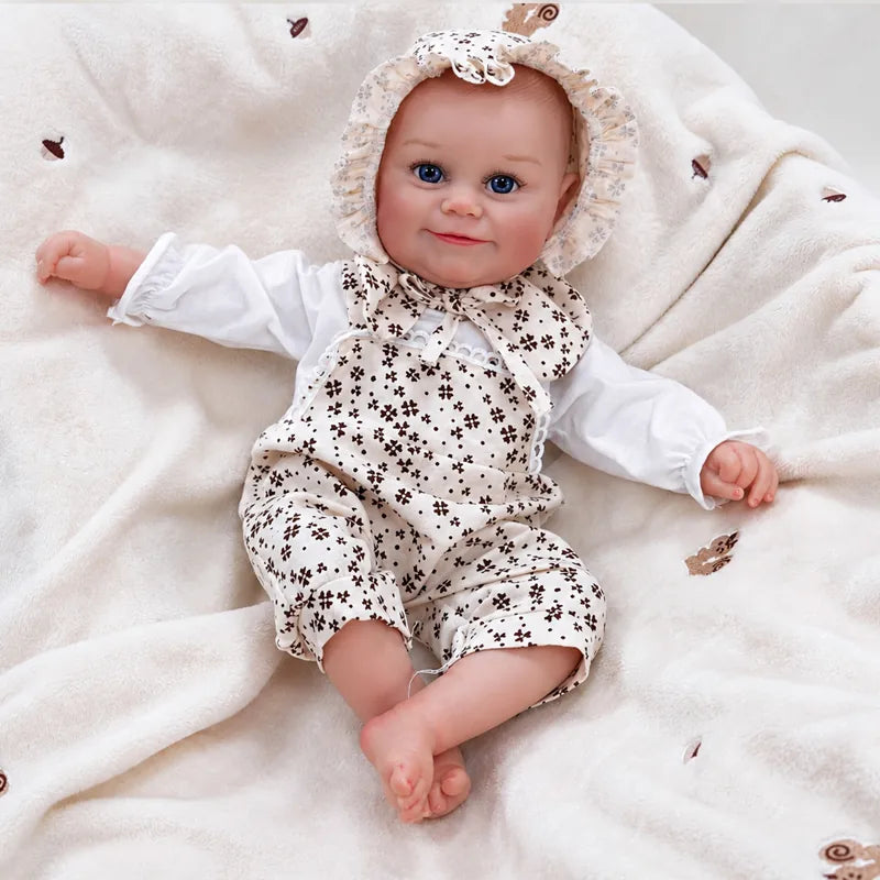 Baby doll resting on a cream blanket, ready for a cozy afternoon of pretend play.