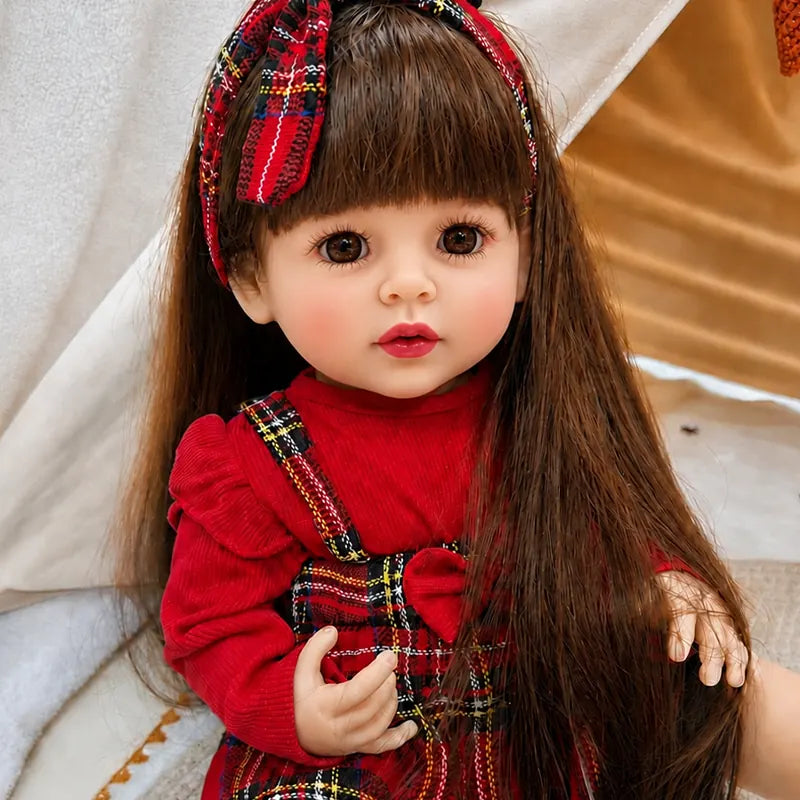 Lifelike reborn doll dressed in a festive red plaid outfit, a charming Christmas or birthday gift for children and reborn doll enthusiasts.