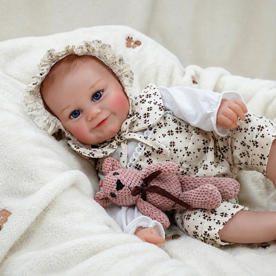 Smiling baby doll in a floral outfit, pictured for doll collectors and imaginative play.