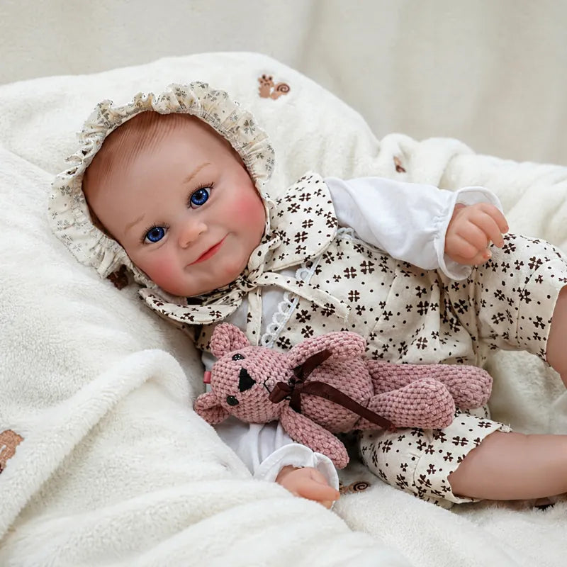 Smiling baby doll in a floral outfit, pictured for doll collectors and imaginative play.