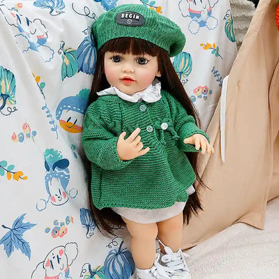 Amelia showcases delicate eyelashes, natural rosy coloring, detailed hands, long brunette hair, and finely textured knitted clothing for a warm, lifelike appearance.