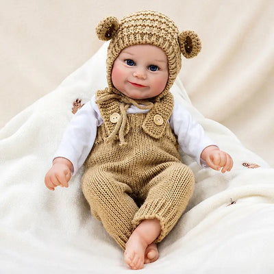 Bear-dressed reborn doll nestled among soft cream blankets for a cozy afternoon indoors.Bear-dressed reborn doll nestled among soft cream blankets for a cozy afternoon indoors.