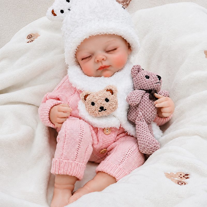 Hand-finished reborn baby doll featuring realistic skin texture, carefully painted details, natural coloring, and finely crafted facial features.