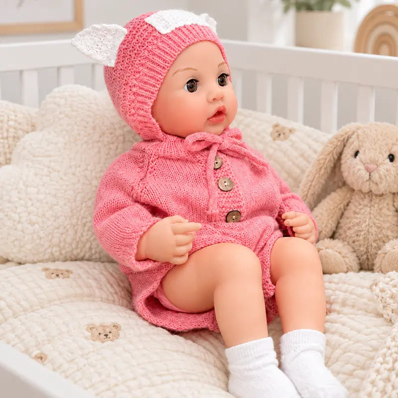 reborn_baby_doll_dressing_in_pink_knit_romper