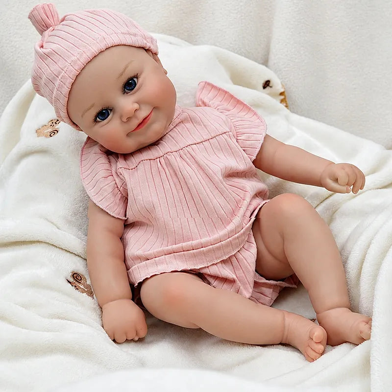 Eliza reborn baby doll posed on a cozy blanket for a nursery display or pretend storytime scene.