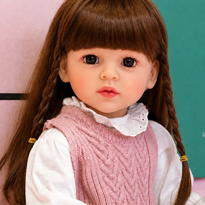 Sweet realistic reborn girl doll in a pink outfit, an adorable choice for Christmas, birthdays, special occasions, and doll collections.