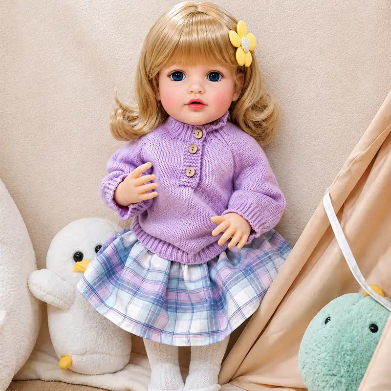 Realistic reborn doll featuring delicate facial details, naturally blushed cheeks, expressive blue eyes, and soft baby-like styling.