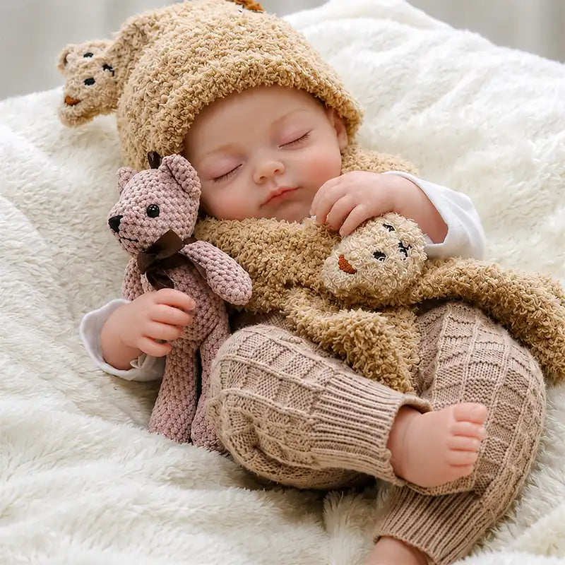 Ultra-realistic reborn baby doll with delicate facial details, naturally rosy cheeks, closed eyes, and a peaceful sleeping expression.