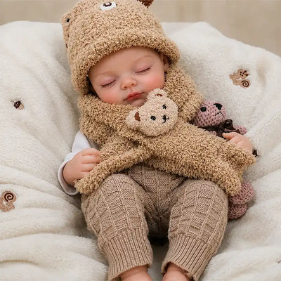 Close-up of a realistic reborn doll featuring fine eyelashes, softly blushed cheeks, natural lips, tiny hands, and detailed baby-like facial features.