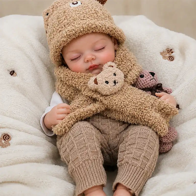 Close-up of a realistic reborn doll featuring fine eyelashes, softly blushed cheeks, natural lips, tiny hands, and detailed baby-like facial features.