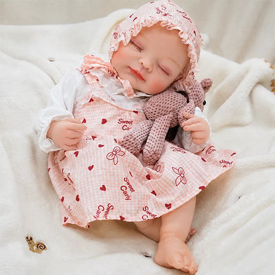 Handcrafted reborn baby doll with detailed skin texture, carefully painted facial features, realistic hands and feet, and a soft baby-inspired finish.