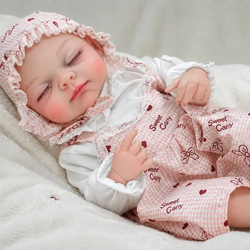 Lifelike reborn baby doll resting peacefully on a soft white blanket, ideal for pretend parenting, nursery play, birthday gifts, and Christmas surprises.