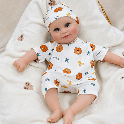 Lifelike baby doll crafted with realistic facial coloring, carefully defined features, smooth skin texture, and finely detailed eyes and lashes.