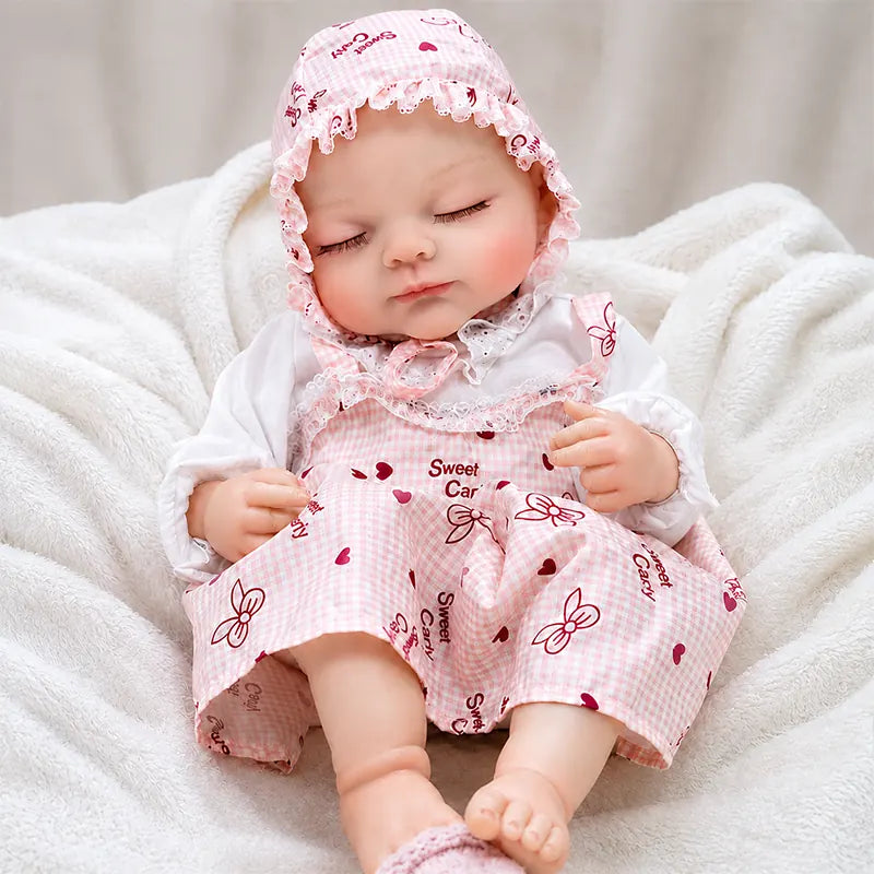 Realistic reborn newborn doll lying in a cozy nursery basket with fluffy blankets, creating a sweet and peaceful baby-care play scene.